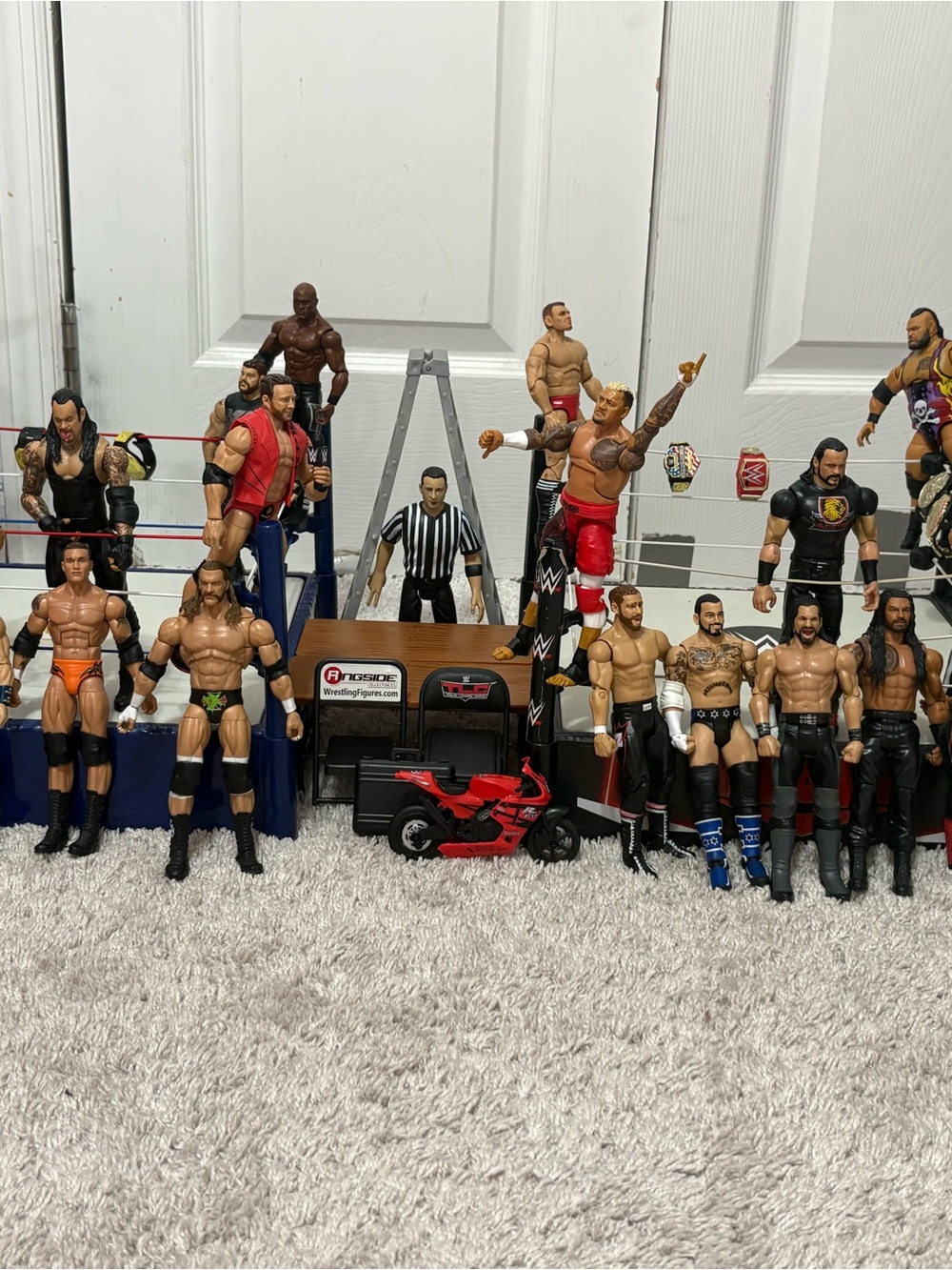 WWE Collectible Figure Set with Red Motorcycle and Black Ring Accessories - WWE